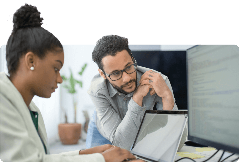 two-IT-professionals-reviewing-code-on-a-computer-screen