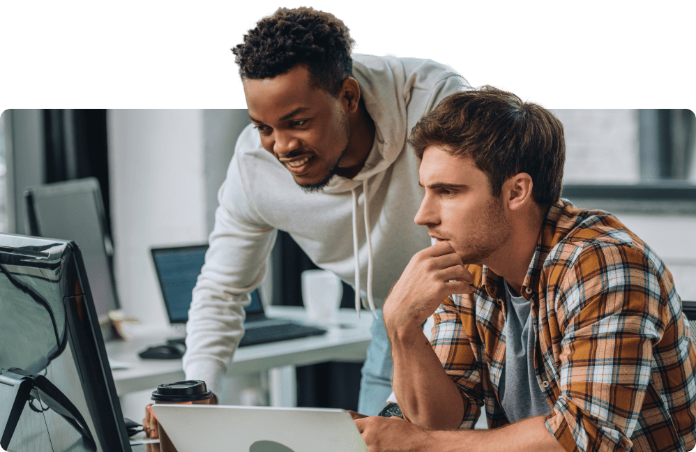 two-engineers-looking-at-computer-in-amazement