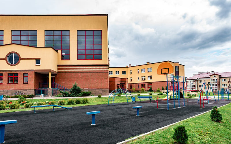 exterior-view-modern-public-school-building-with-playground-1