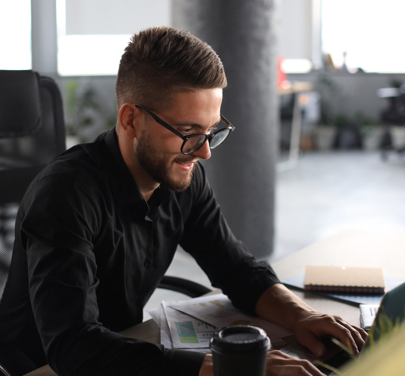 young-modern-business-man-analyzing-data-using-laptop-while-working-office-2